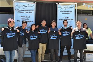 Arroyo High School students receive “AHS College Bound” T-shirts during the inaugural “Knights Charging Forward” celebration  